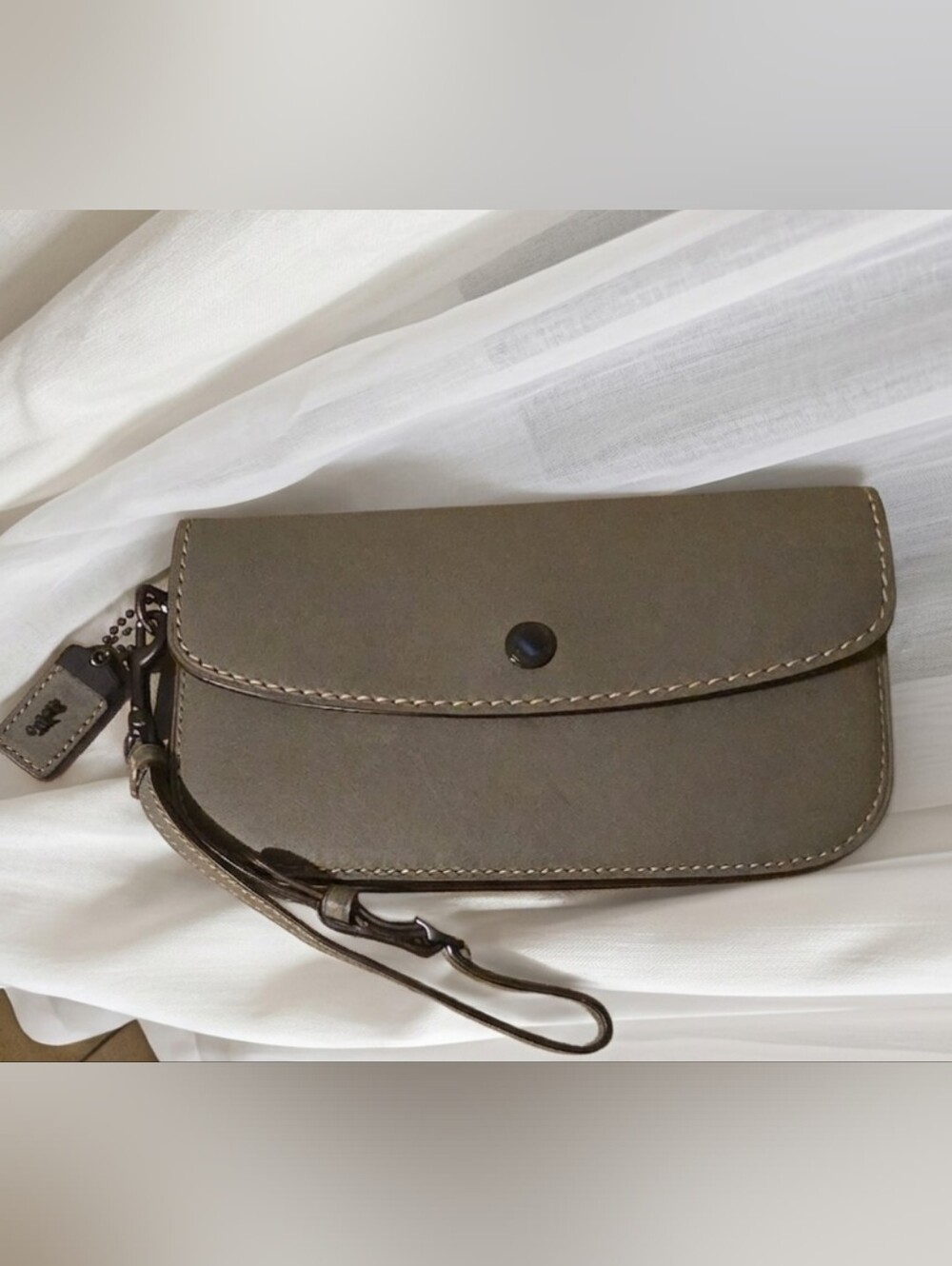 Coach 1941 Clutch Wristlet in a grey glovetanned leather.